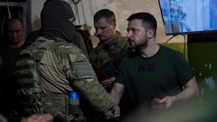Ukraine's President Volodymyr Zelensky awards a soldier as he visits a position of Ukrainian service members in Lysychansk, the Luhansk region of Ukraine, on June 5, 2022.